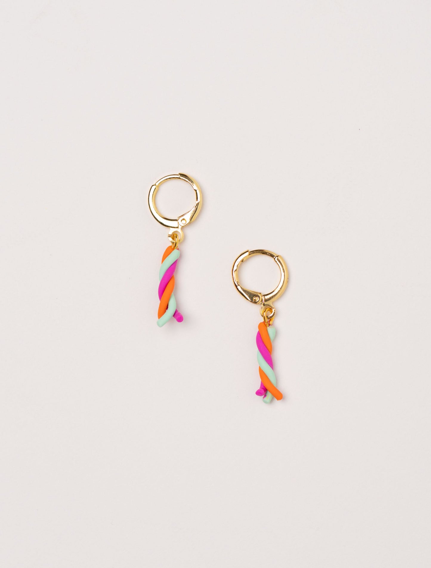 Twist Pop earrings by Little APÖ, handmade polymer clay earrings inspired by colorful candy twists, small, playful, and lightweight for young girls.