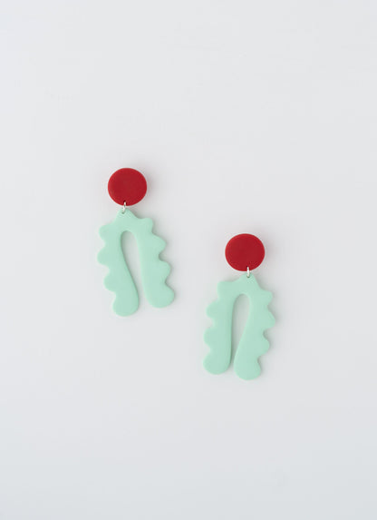 Lucy earrings by APÖ, handcrafted polymer clay earrings with a curved arch design and a small contrasting circle on top, medium-sized, colorful, and lightweight.