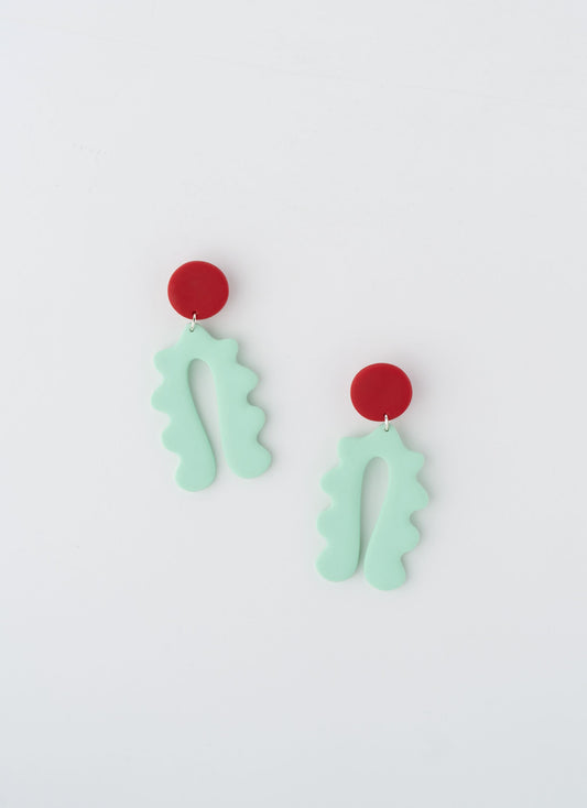 Lucy earrings by APÖ, handcrafted polymer clay earrings with a curved arch design and a small contrasting circle on top, medium-sized, colorful, and lightweight.