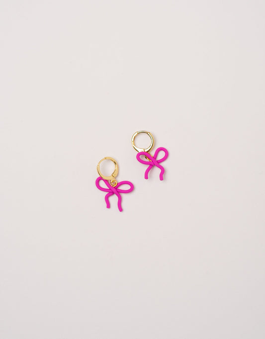 Wavy Bow earrings by Little APÖ, handmade polymer clay earrings in a small wavy ribbon shape, unicolor, lightweight, and designed for young girls.